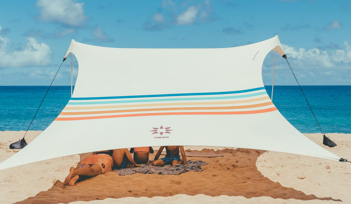 Neso Portable Beach Tent Sun Shelter with Sand Anchor - Lightweight Beach Shade Canopy - Easy Setup for Family Outings - Patented Reinforced Corners - UPF 50+ Sun Protection - 7 x 7ft - Rainbow