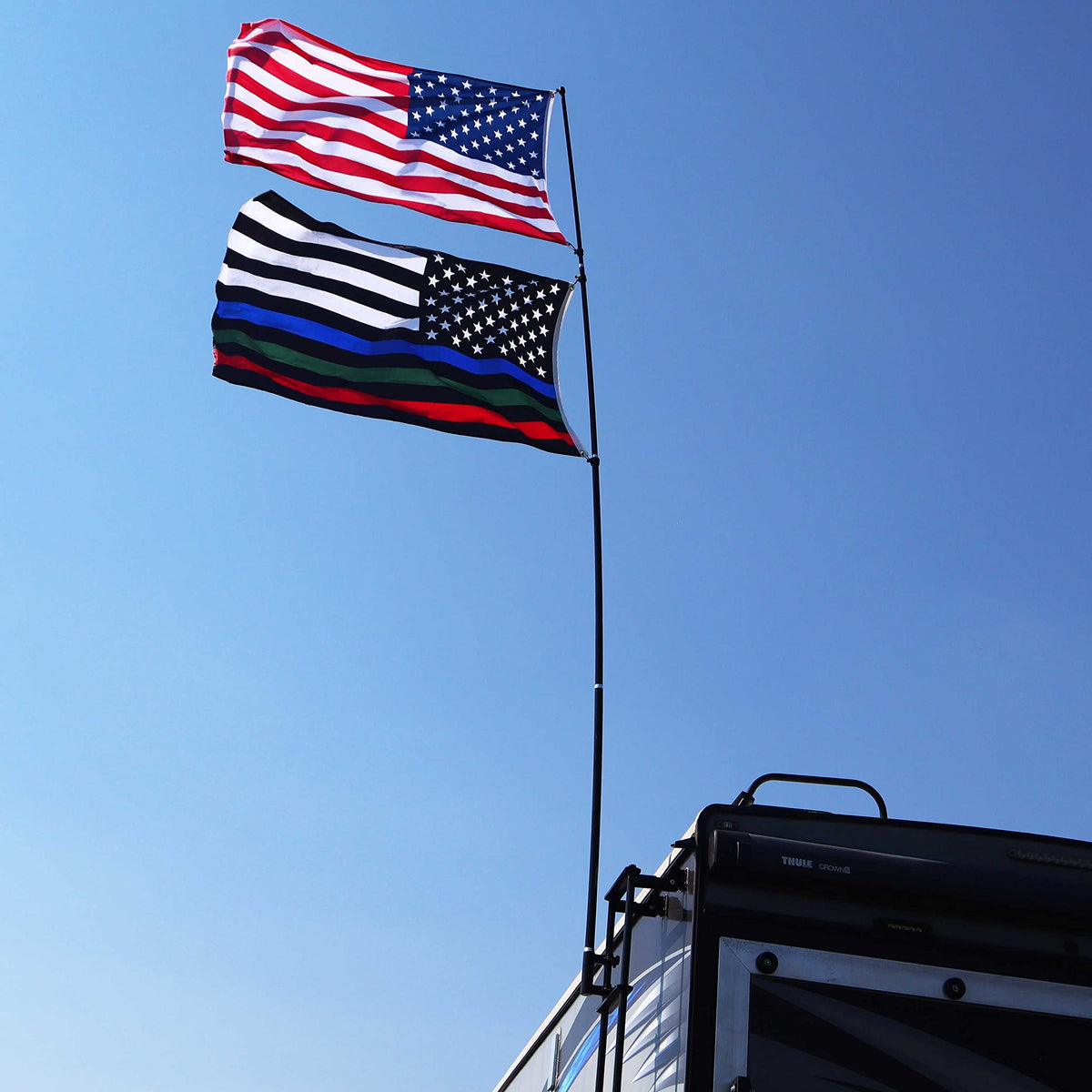 The Traveler Two Flag RV Ladder Flag Pole Kit. Includes Two Beautiful 3’x5’ Flags, Steel RV Flag pole Mount, Fits Standard 1” RV Ladders,14ft Fiberglass Retractable Pole, And A Storage Bag.